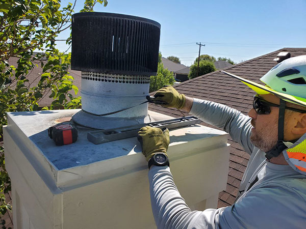 Technician Fixing Chimney