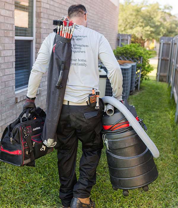 Technician with Chimney Sweeping Equipment
