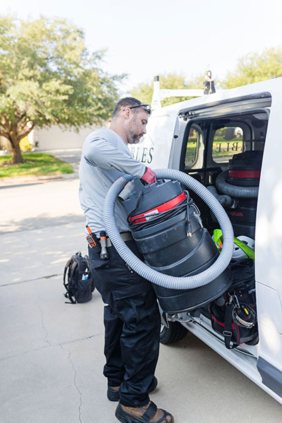 Technician with sweep equipment