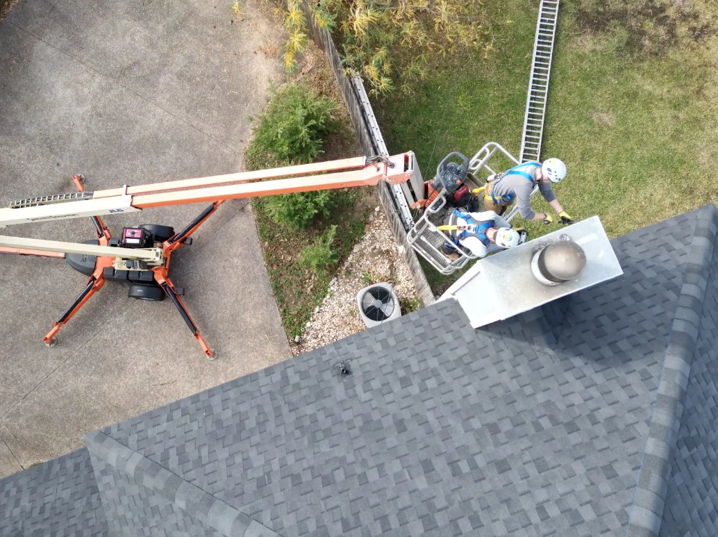 chimney work on roof with lift