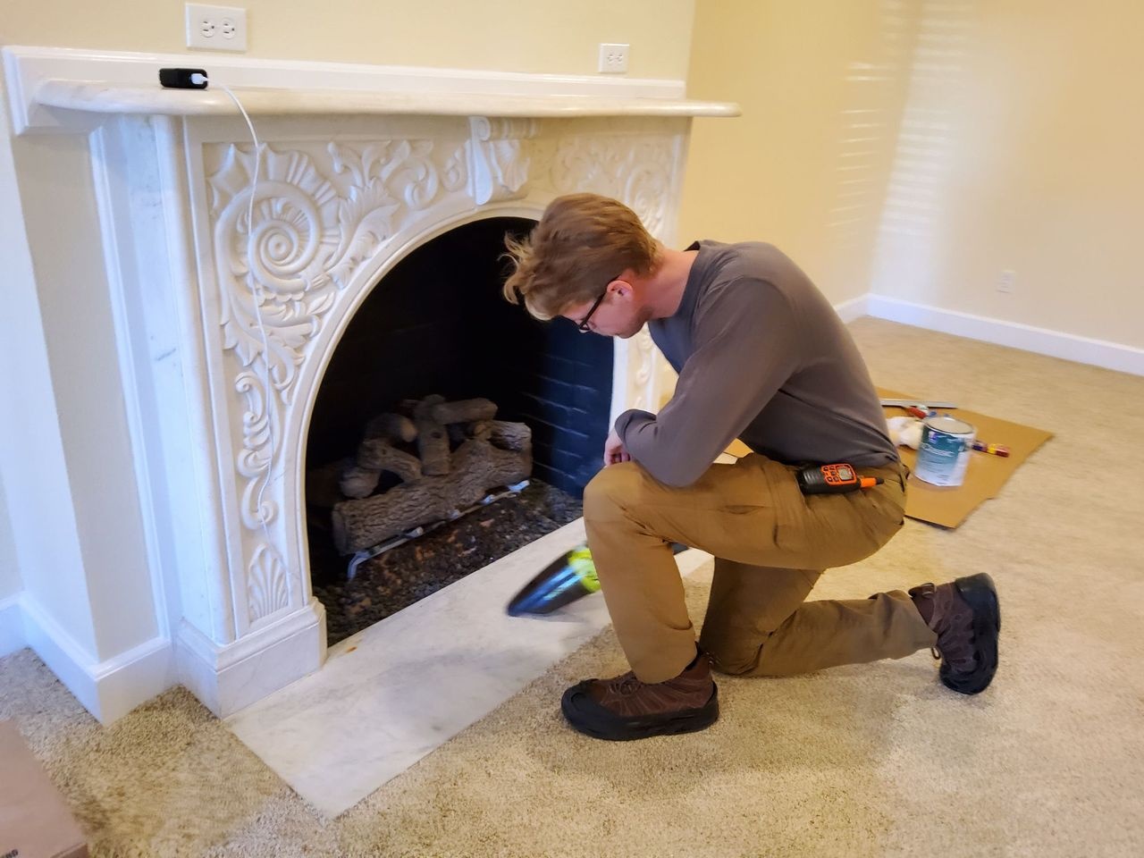 service technician working fireplace area service technician working fireplace area